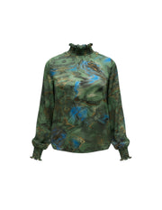 Blouse Martina Devï Studios SARL verte et bleue avec un imprimé marbre abstrait et des détails dorés, col montant froncé et poignets élastiqués.