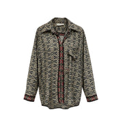 Chemise JM Devï Studios SARL à motif abstrait beige et noir, 70% soie, 30% viscose. Manches longues, col chemise.