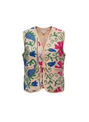 Gilet rond Devï Studios SARL en coton beige avec broderies florales roses, bleues et vertes. Fermeture par lacet.