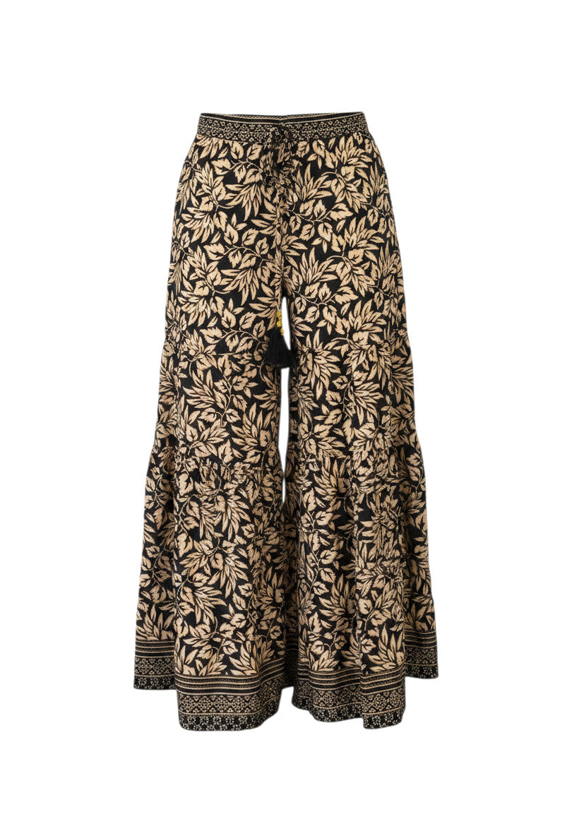 Devï Studios SARL pantalon large noir et beige à motif floral, taille haute, ceinture à cordon avec pompon.