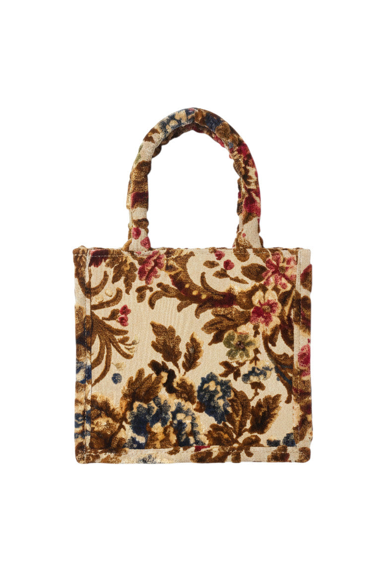 Sac à main Devï Studios SARL en velours upcyclé avec un motif floral complexe dans des tons crème, marron, bleu et bordeaux.