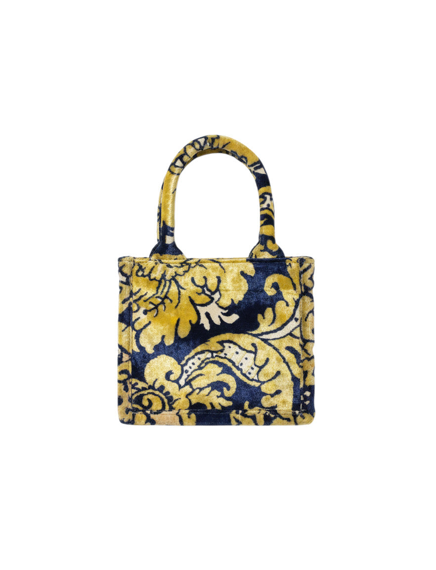 Sac à main Devï Studios SARL en velours bleu marine et jaune avec un motif floral abstrait, fait à la main à partir de textiles vintage.