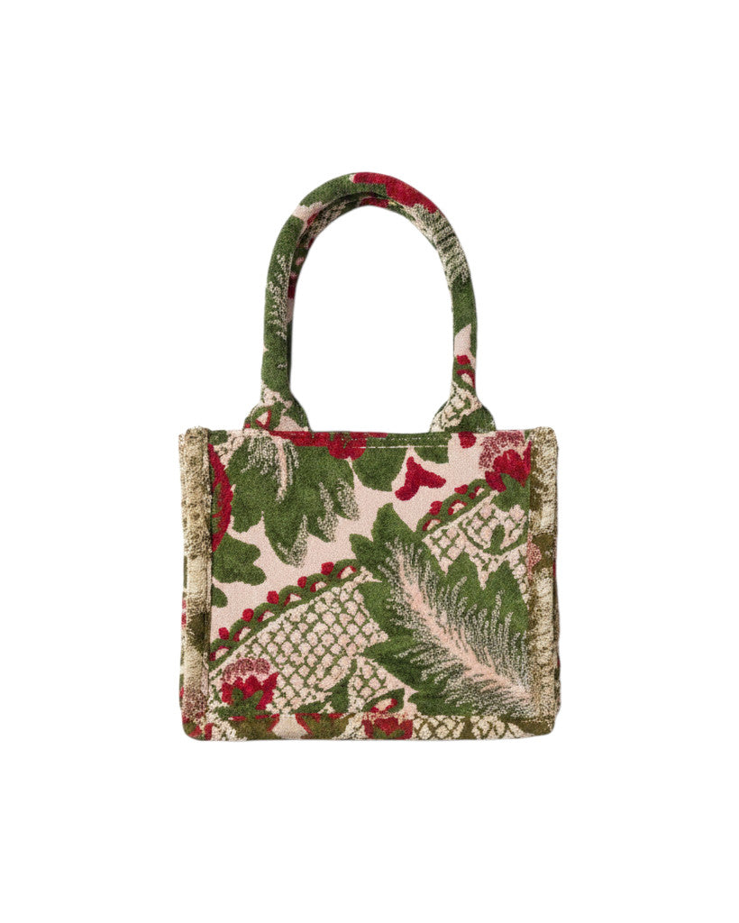 Sac à main Devï Studios SARL en velours upcyclé avec un motif floral abstrait vert et rouge, bordure texturée.