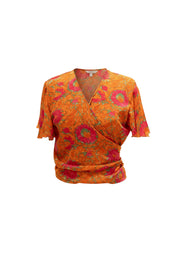 Top cache-cœur Pamela Devï Studios SARL orange à imprimé floral rose et vert, manches courtes, en soie et viscose.