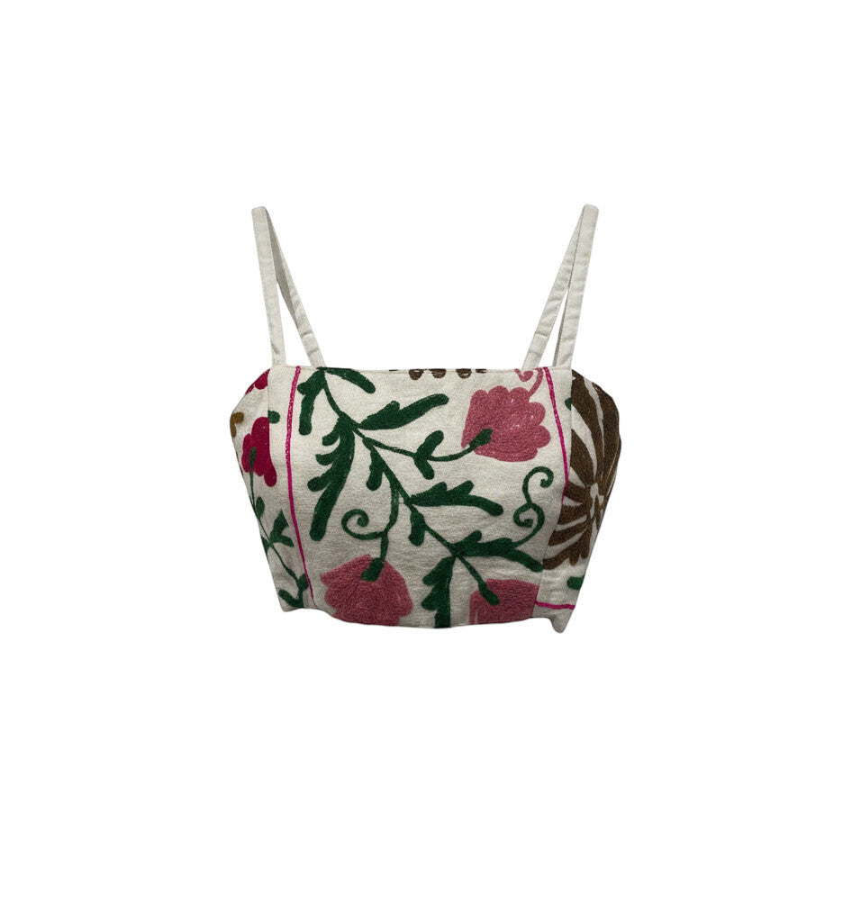 Devï Studios SARL top Pipa en coton blanc avec broderies florales multicolores et liens à nouer.