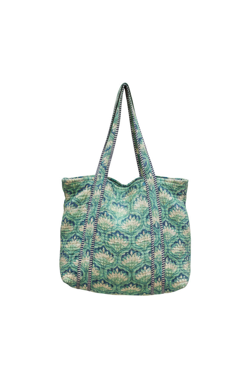 Devï Studios SARL tote bag en coton réversible bleu sarcelle et blanc avec imprimé floral abstrait.